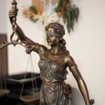 Justicia Lady Justice with scales and sword in office