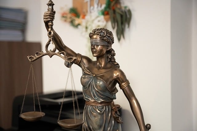 Justicia Lady Justice with scales and sword in office