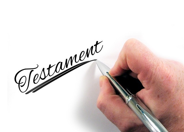 Silver pen writing cursive Testament